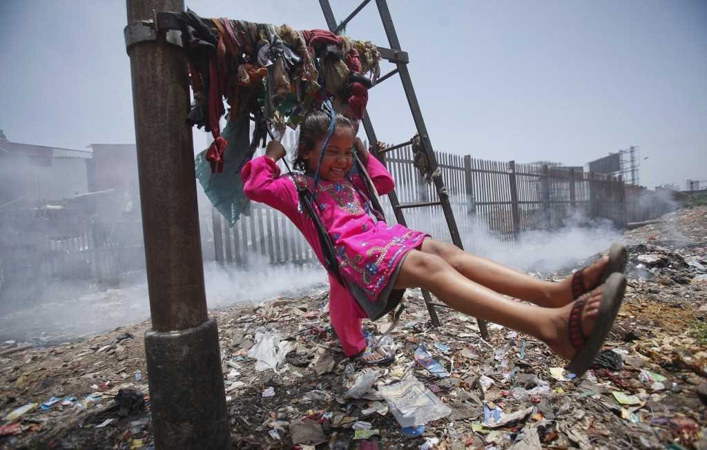A child playing in garbage dump