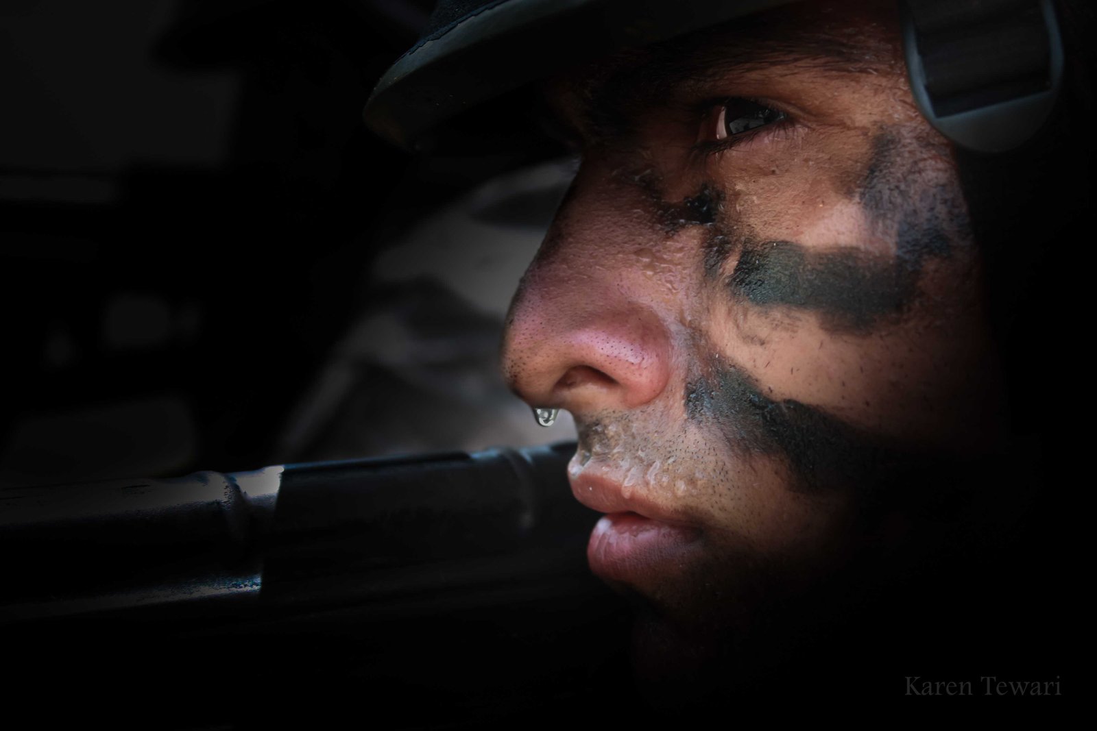 Sweat-faced soldier ready for ambush-Karen Tewari-fnbworld